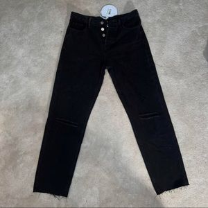 Black jeans with ripped knees